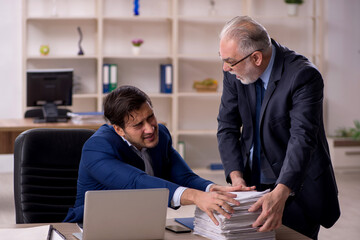 Two male colleagues working in the office