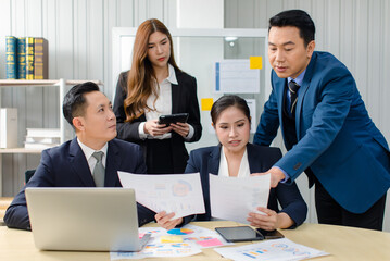 Asian professional successful male female businessmen businesswomen in formal business suit sitting standing talking in video call meeting online in laptop notebook computer