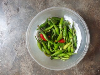 Fresh chili in a bowl, cayenne pepper. Using the macro camera.