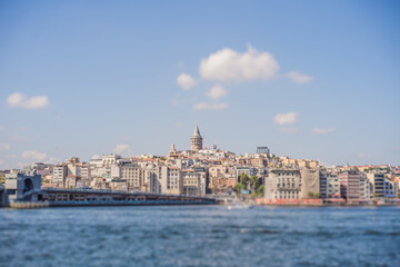 Fototapeta na wymiar Istanbul city skyline in Turkey, Beyoglu district old houses with Galata tower on top, view from the Golden Horn