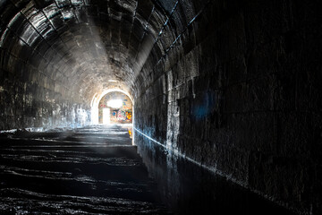 Obraz premium The Merriton Tunnel, also known as the Blue Ghost Tunnel, is an abandoned tunnel on the former Grand Trunk Railway running under the Welland Canal in Ontario.