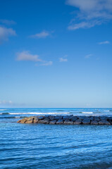 Ocean and Break Wall at Waikiki Beach on the Island of Oahu, Hawaii.