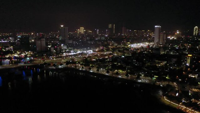Night time aerial of city, Han River and skyline in Danang, Vietnam.