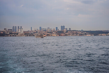 Fototapeta premium Muslim architecture and water transport in Turkey - Beautiful View touristic landmarks from sea voyage on Bosphorus