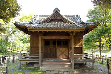 An old shrine surrounded by forests