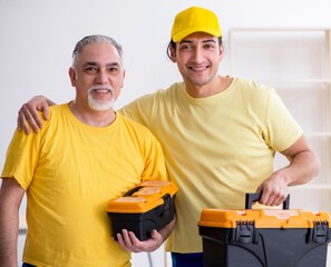 Two contractors carpenters working indoors