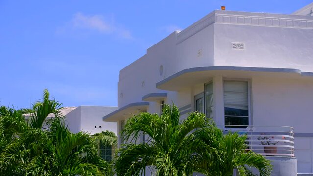 Video of Miami Beach art deco apartment buildings and palms 4k 24p prores