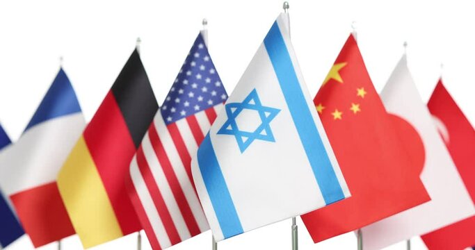 The flag of Israel next to the flags of countries from different continents. The international cooperation