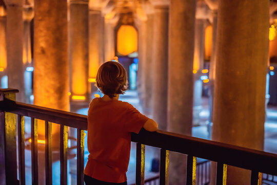 boy tourist enjoying Beautiful cistern in Istanbul. Cistern - underground water reservoir build in 6th century, Istanbul, Turkey, Turkiye