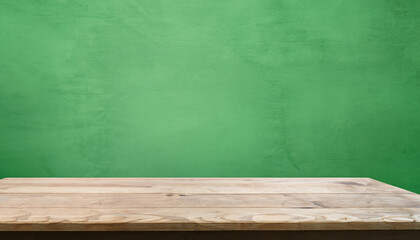 Wooden desk and dark green wall with shadows. Empty space for your product.