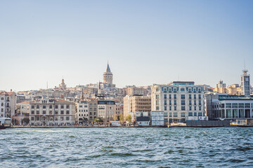 Fototapeta premium Istanbul city skyline in Turkey, Beyoglu district old houses with Galata tower on top, view from the Golden Horn