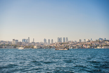 Obraz premium Muslim architecture and water transport in Turkey - Beautiful View touristic landmarks from sea voyage on Bosphorus