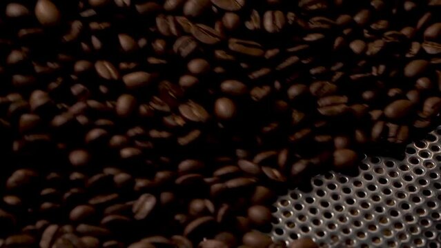 close up of coffee beans in industrial roasting process