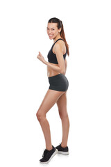 Fototapeta premium Happy woman, fitness and fist in celebration for workout success isolated on a transparent PNG background. Fit, active and sport female person or winner in victory, achievement or goals for exercise