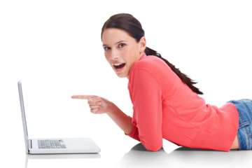 Laptop, pointing and wow with a woman student lying on the floor isolated on a transparent background. Computer, internet and surprise with a happy young female university pupil studying on PNG