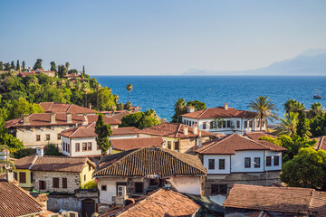 Fototapeta premium Old town Kaleici in Antalya. Panoramic view of Antalya Old Town port, Taurus mountains and Mediterrranean Sea, Turkey