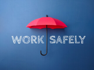 Red umbrella with the word WORK SAFELY