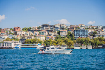 Fototapeta na wymiar Muslim architecture and water transport in Turkey - Beautiful View touristic landmarks from sea voyage on Bosphorus