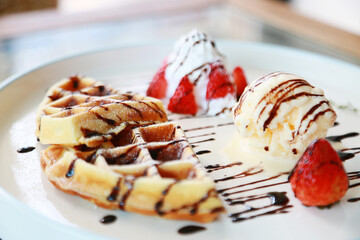 Waffle get served in the morning in the restaurant or the cafe. Food and drink set made by chef and served with hot drink. Healthy food or junk food was select by people.