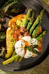 Grilled Toast witch Asparagus, avocado, Poached egg, greens, bacon on green textured background. banner, menu recipe place for text, top view. Traditional breakfast.