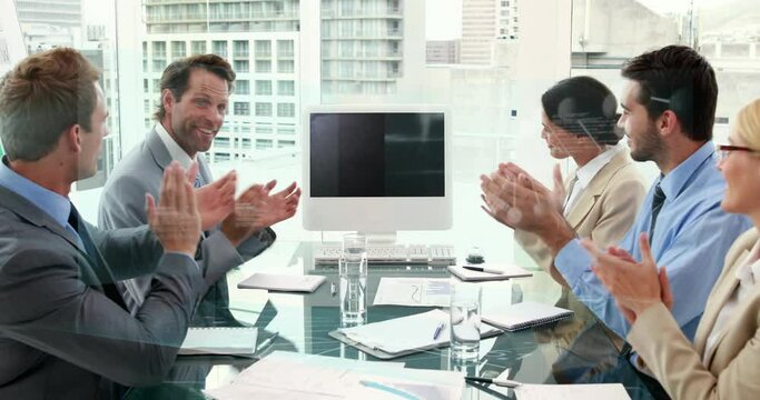 Animation of diverse businesspeople clapping together looking at a computer screen with copy space