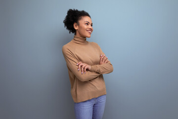 isolated with background, smiling pretty young brunette hispanic woman with ponytail