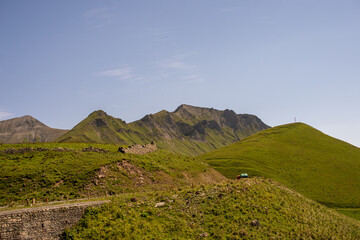 High mountains and nature on the Georgian military road. A small settlement near the mountain