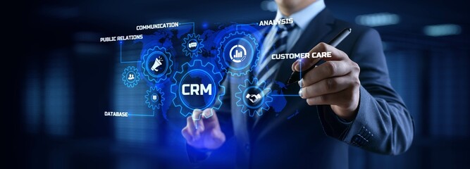 Fototapeta premium CRM Customer relationship management concept. Businessman pressing button on screen.