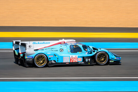 Le Mans, France - June 10, 2023: The Glickenhaus 007 race car No. 709, from the Glickenhaus Racing team, in the Tertre Rouge turn on the Circuit de la Sarthe race track during the 24 hours of Le Mans.