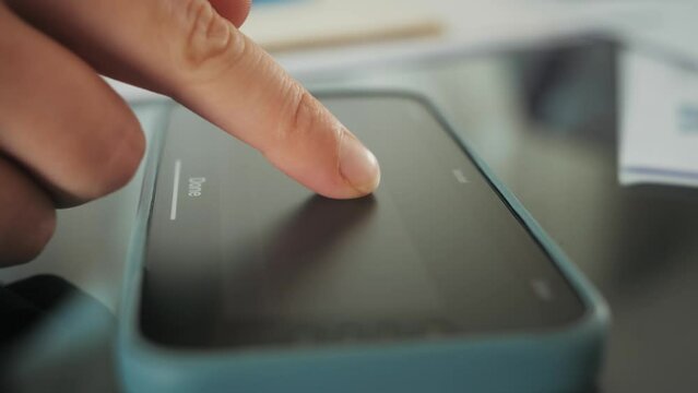 Electronic signature on the document. Finger puts an electronic signature on the tablet screen.