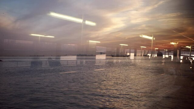 Abstract reflections like a multiple exposure image on a tour boat window at Istanbul in sunset time.