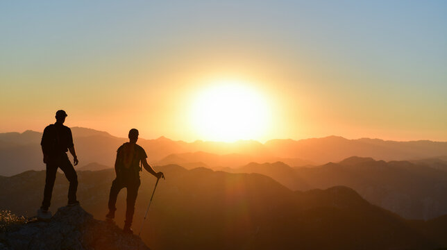 Friends Saluting the Sun from the Peak