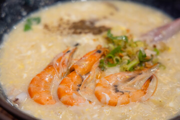 Seafood shrimp congee rice bowl in restaurant
