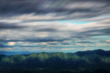 The light hits the mountains and the clouds motion. (Lampang province, Thailand). amazing natural landscape. popular attractions best famous tourist attractions