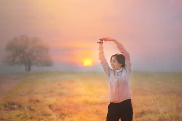 Free happy woman enjoying nature, young beauty with morning sunlight.