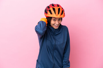 Teenager cyclist girl isolated on pink background laughing - obrazy, fototapety, plakaty