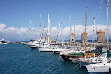 Obraz premium Mandraki Harbor in the Dodecanese island of Rhodes, Sailing-boats