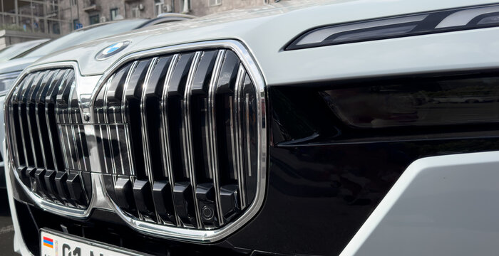 Yerevan, Armenia, June 10, 2023: Close up BMW i7 radiator grill and headlight. BMW I7 flagship limousine with electric drive. 