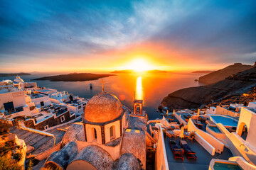 Golden hour in Fira overlooking the St. John church and caldera on Greek island of Santorini - obrazy, fototapety, plakaty