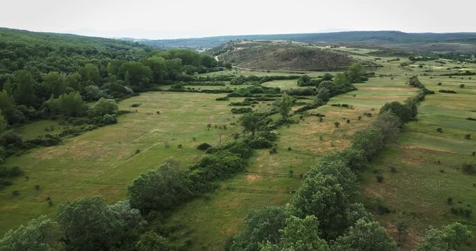 Aerial view of sierra de la demanda, Spain. Dron film green nature, trees and crop.