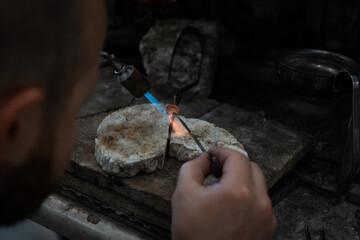 Jewelry soldering gold, close-up details of the production.