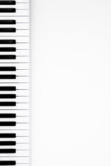 Fototapeta na wymiar Musical keyboard on a white background, flat lay, space for text. Minimalistic music background, conceptual minimalism.