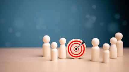 Target, Achieving goal concept. Wooden figures standing around dartboard and arrow for creative...