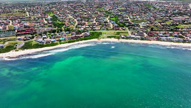 South Africa JBAY Jeffreys Bay aerial drone town home buildings most stunning white sand beach epic surf wave aqua blue rugged reef coastline daytime WSL Corona Open Supers Boneyard summer pan up