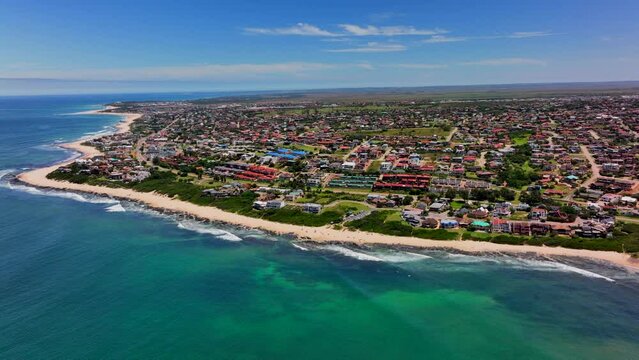 South Africa JBAY Jeffreys Bay aerial drone town home buildings most stunning white sand beach epic surf wave aqua blue rugged reef coastline daytime WSL Corona Open Supers Boneyard summer back motion