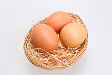 Three Brown Eggs in Rattan Basket III