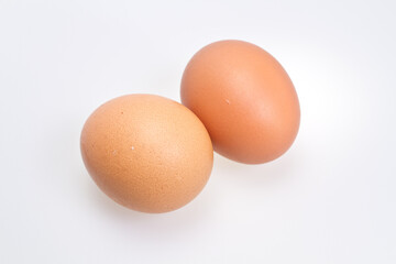 Two Brown Eggs on White Background
