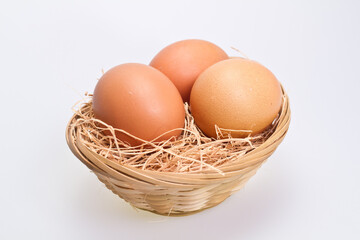 Three Brown Eggs in Rattan Basket II