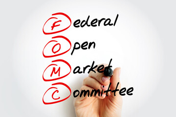 FOMC Federal Open Market Committee acronym - committee within the Federal Reserve System, conducts...