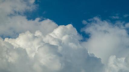 Blue clouds in the sky. White fluffy clouds. Clouds close-up